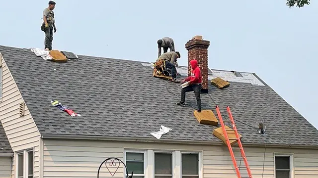 The Rhino Roofing crew working together on a residential roof