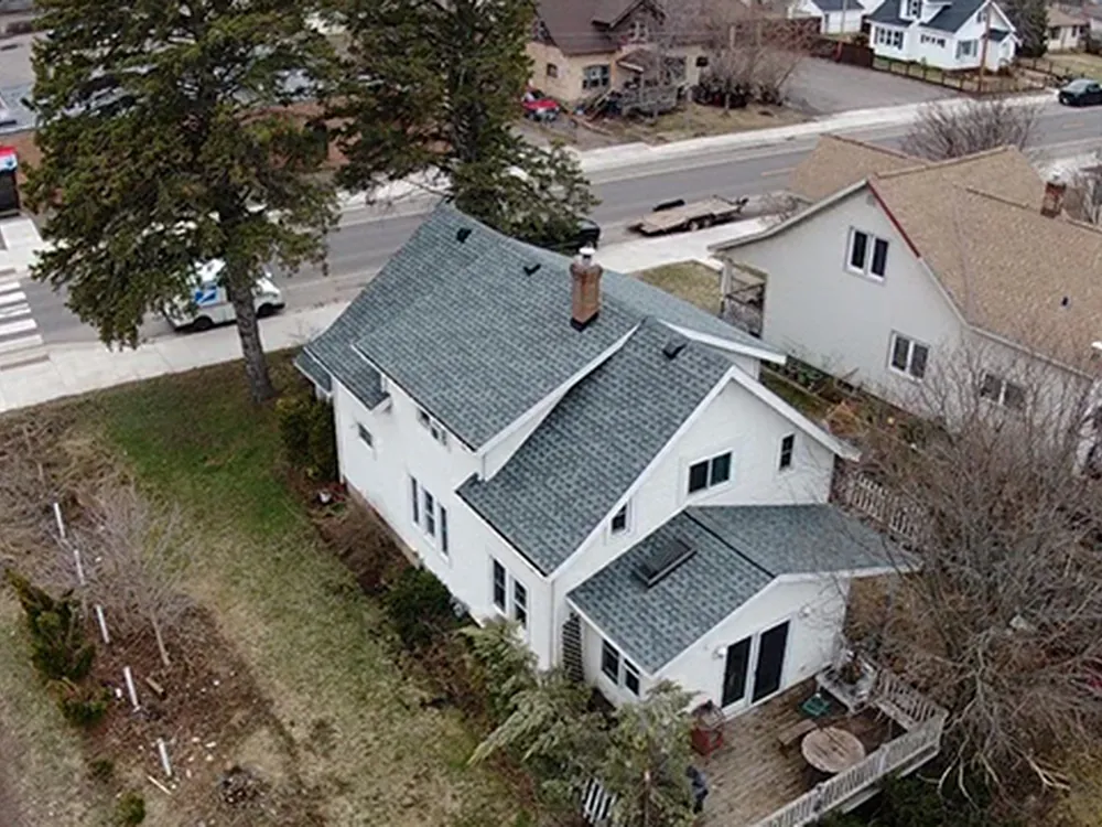 Aerial view of a large multi-section shingle roof completed by Rhino Roofing
